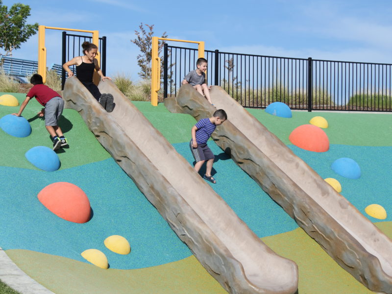 families playing at hillside park