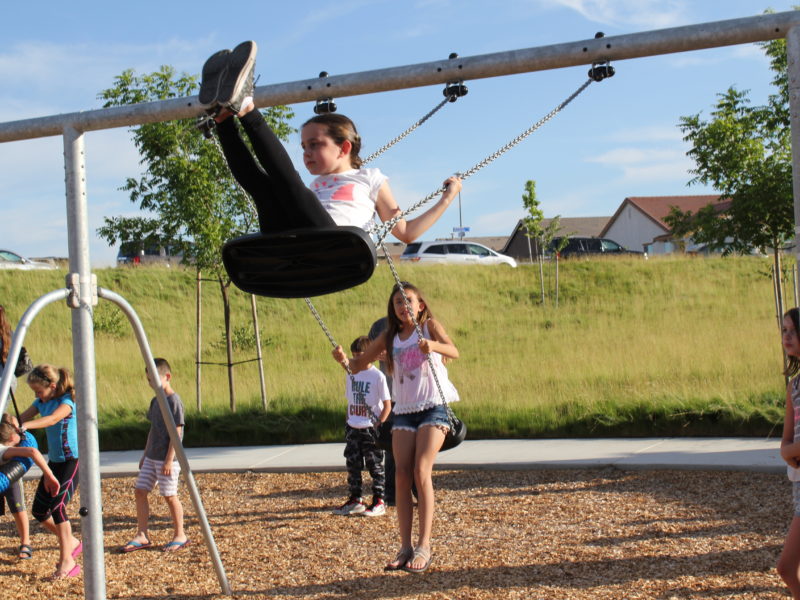 families playing at hillside park