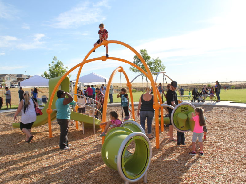 families playing at hillside park